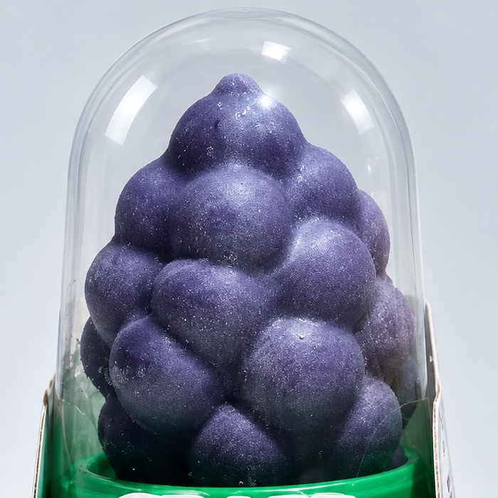 Purple grape bunch shaped ice cream inside a clear dome cup