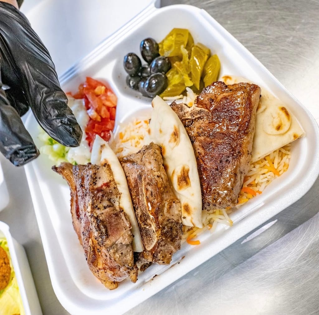 Fresh lamb chops platter with rice and salad