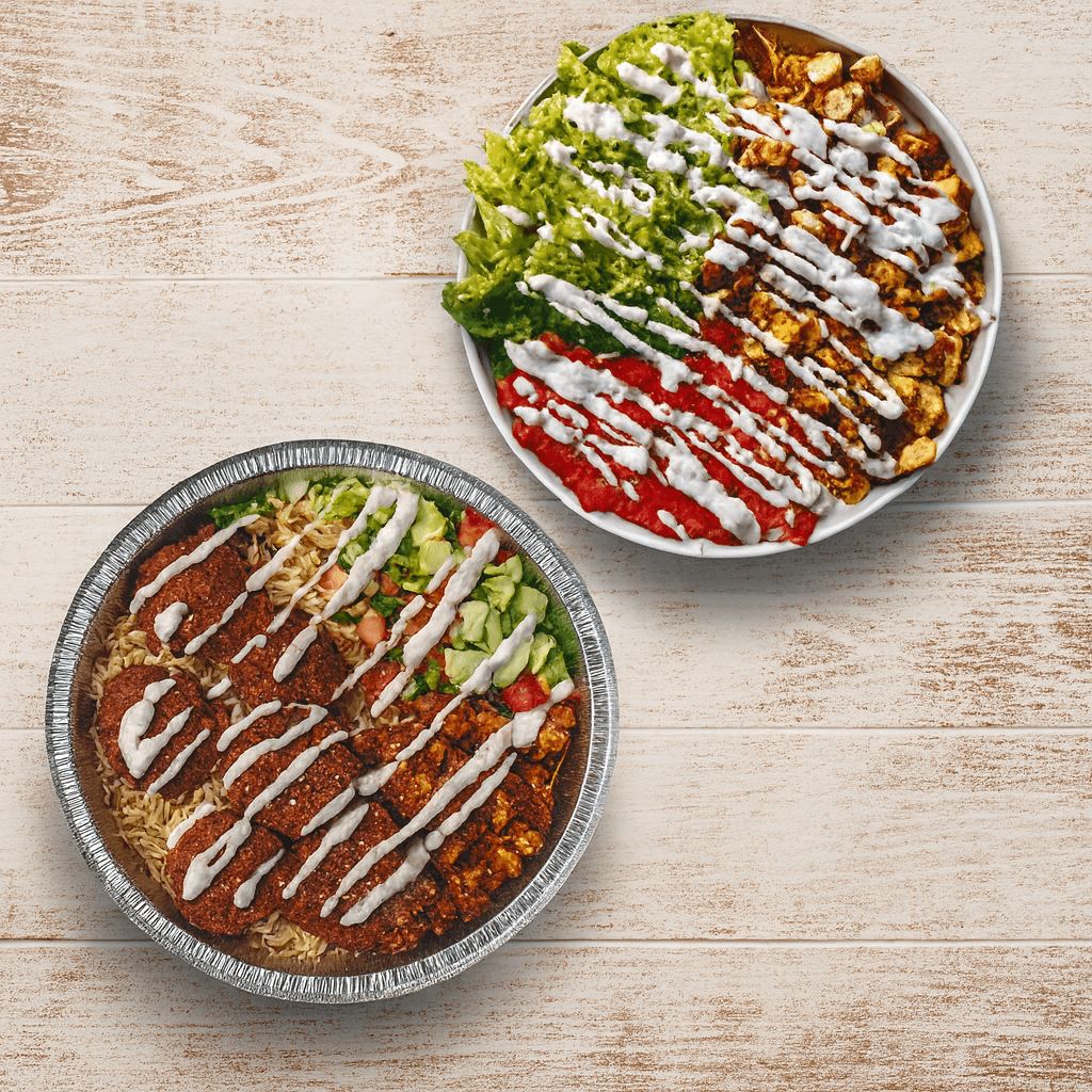 Two halal cart platters with chicken, lamb, rice, salad and white sauce